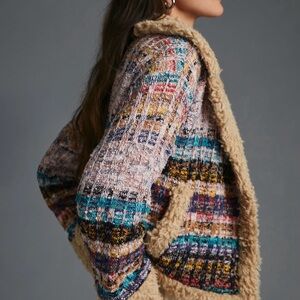 Anthropologie faux shearling-trimmed cropped sweater coat.